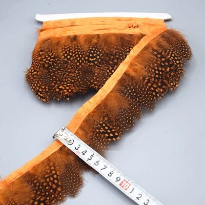 Тесьма из перьев цесарки на ленте 6-10 см, 1м. Оранжевый цвет